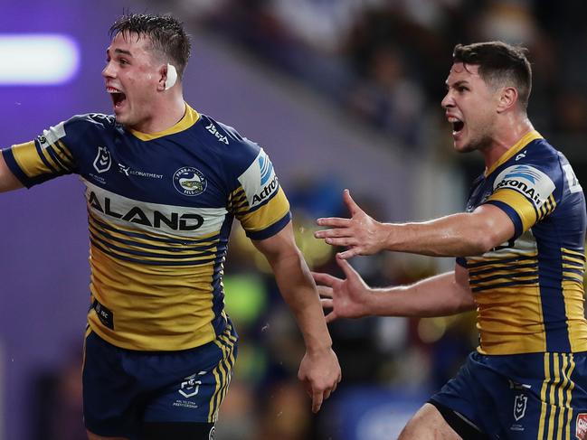 SYDNEY, AUSTRALIA - MARCH 12: Reed Mahoney of the Eels celebrates scoring a try with team mate Mitchell Moses of the Eels during the round 1 NRL match between the Parramatta Eels and the Canterbury Bulldogs at Bankwest Stadium on March 12, 2020 in Sydney, Australia. (Photo by Mark Metcalfe/Getty Images)