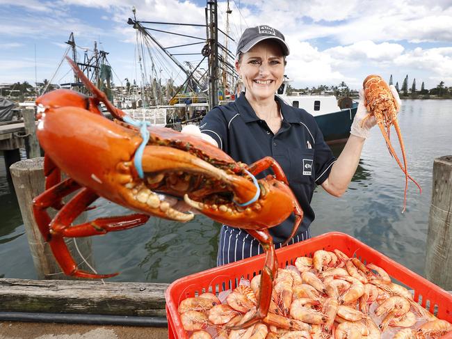 Sharon Young at Mooloolaba Fish Market, which is continuing to operates its retail arm despite the effects of COVID-19. Picture: Josh Woning/AAP