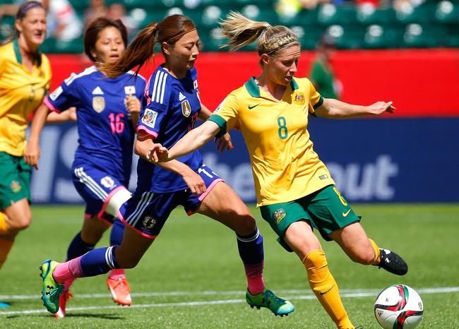 Elise Kellond-Knight of the Matildas against Rumi Utsugi of Japan during a 2015 FIFA Women’s World Cup match. Picture: Kevin C. Cox/Getty