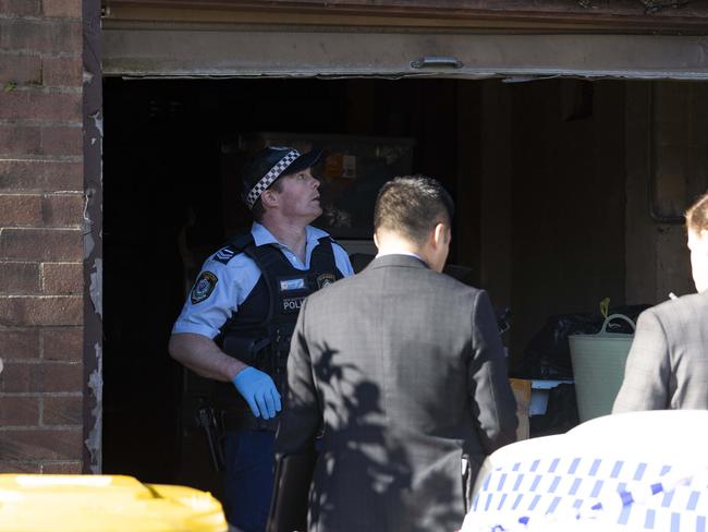 Police search for evidence at a the house on Friday. Picture: Tom Parrish