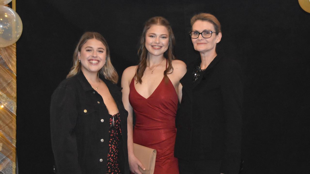 Laura, Isobel and Christine Hughes at the 2022 Kawana Waters State College formal. Picture: Sam Turner