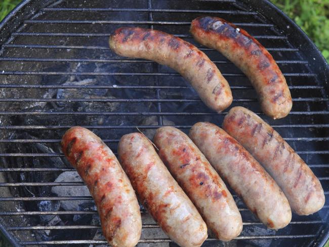 Generic image of sausages being cooked on a Weber barbeque.