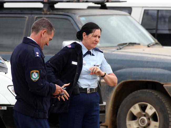 Off to inspect the search area, Assistant Commissioner Carlene York (right) prepares to board a police helicopter at the Nowendoc command centre where the search for fugitive Malcolm Naden was co-ordinated from.