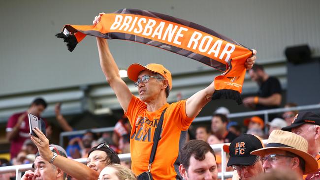 A Roar fan celebrates a goal during the round six A-League match between Brisbane Roar and Melbourne City at Dolphin Stadium. Picture: Jono Searle/Getty Images