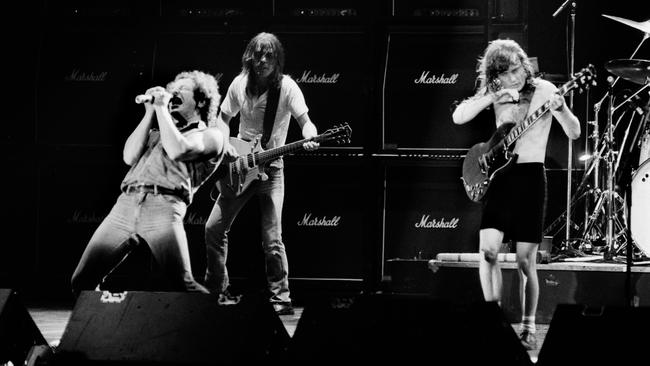 Malcolm Young, centre, with singer Brian Johnson and brother Angus at the Palais Omnisport of Paris Bercy, on September 15, 1984. Picture: AFP