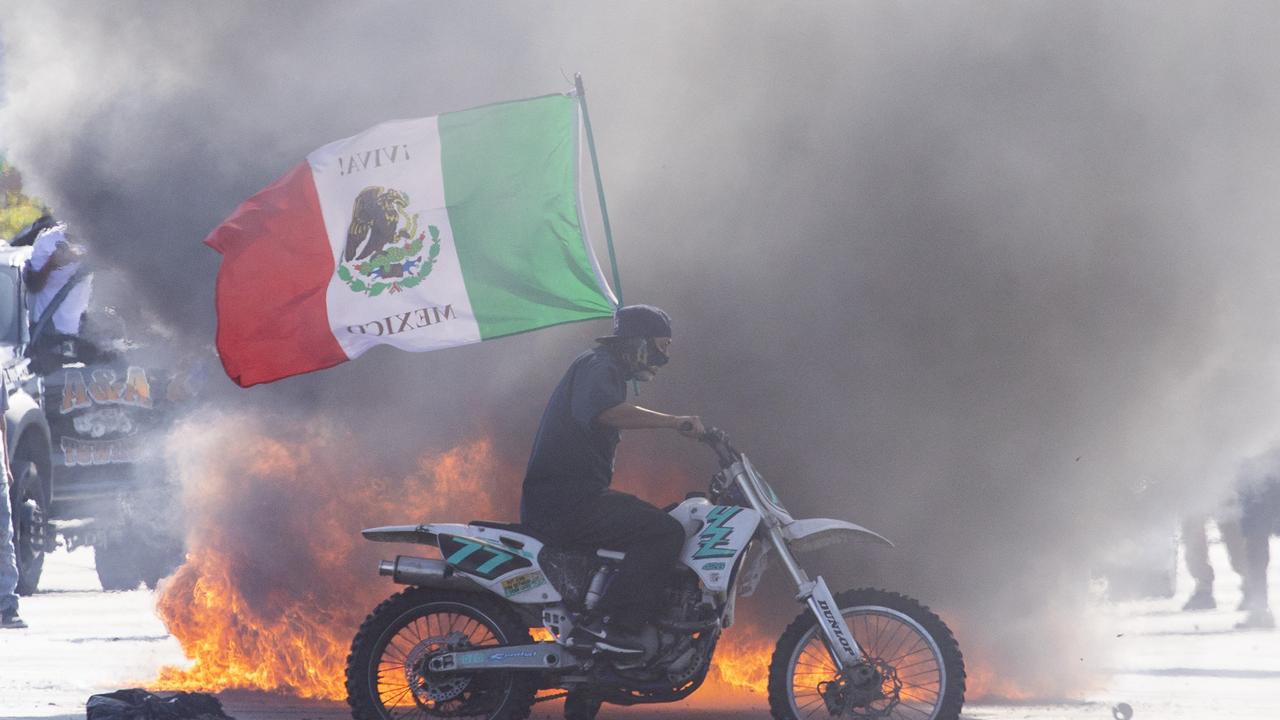 ‘INVADED, OCCUPIED’: Apocalyptic images as US descends into chaos