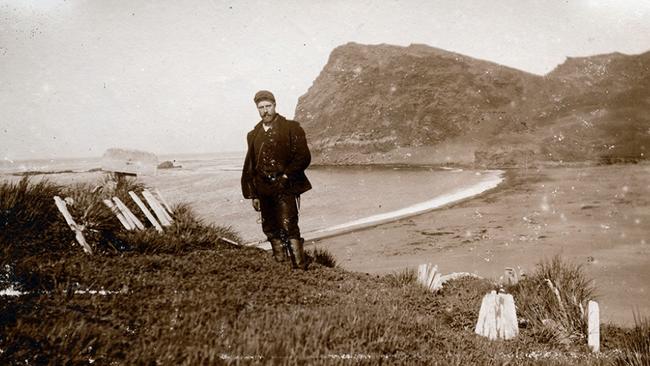 Anders Harboe-Ree standing in an old graveyard on Possession Island, Crozet Islands, 1906 or 1907. The men buried in the graveyard would have been sealers or whalers from the first half of the the nineteenth century.