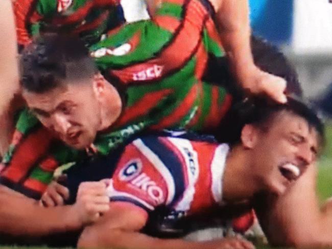 ONE TIME USE ONLY.Rabbitohs captain Sam Burgess pulls the hair of Sydney Roosters rookie Billy Smith in the NRL R25 clash at ANZ Stadium on Friday night. Souths won 16-10.