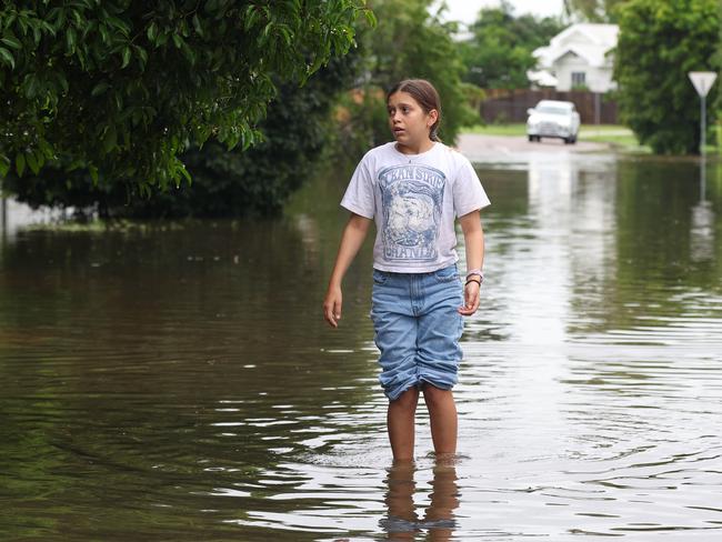 TOWNSVILLE, AUSTRALIA - NewsWire Photos - February 3, 2025: Annabella Giorgas 11 walks along her street in Hermit Park as Townsville residents endure another day of heavy rain and threats of catastrophic flooding. Picture: Adam Head /NewsWire