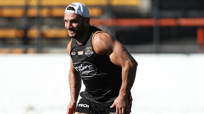 Robbie Farah runs on his injured leg during Wests Tigers training. Picture: Brett Costello