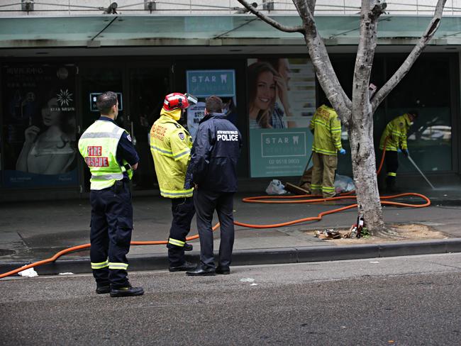 Emergency services at the scene of the alleged attack on Sunday. Picture: Adam Yip