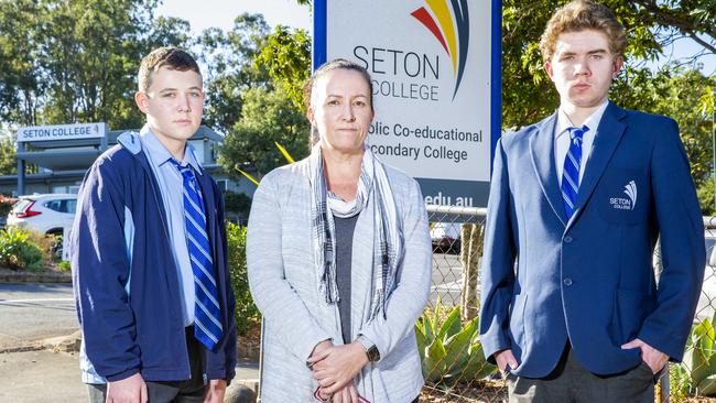 Parent Nicky Reed with 14-year-old Kyal and 16-year-old Tyler outside Seton College in Mt Gravatt East. Picture: Richard Walker