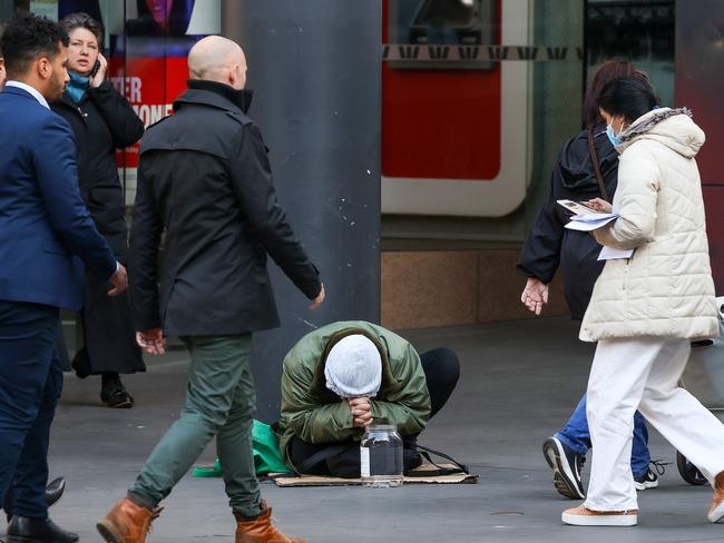 MELBOURNE, AUSTRALIA - NewsWire Photos AUGUST 25, 2022 : Elizabeth Street in the CBD at times can be a haven for the homeless. A man begs on the corner of Elizabeth St. and Collins St. Picture NCA NewsWire / Ian Currie