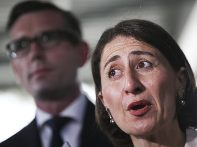 New South Wales Premier Gladys Berejiklian stops at Heathcote train station with New South Wales Treasurer Dominic Perrotet and Heathcote MP Lee Evans during her campaign ahead of the state election on Saturday. Picture: Dylan Robinson