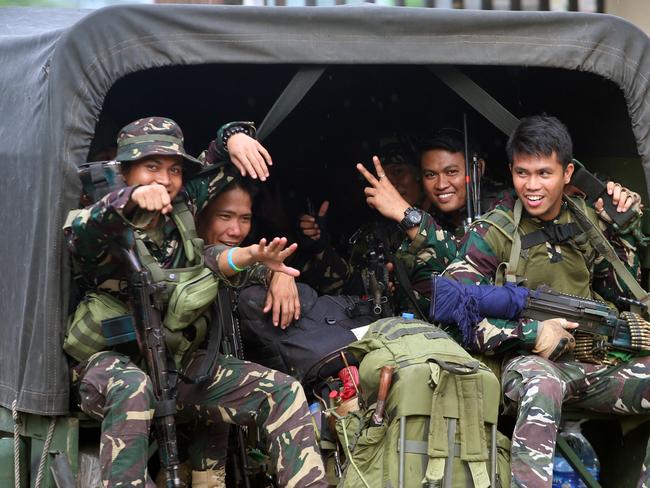 Soldiers head back to the frontlines in Marawi. Picture: Gary Ramage