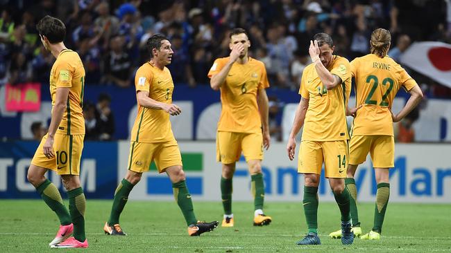 Australian players react to Japan's goal during the group B World Cup 2018 qualifying football match.