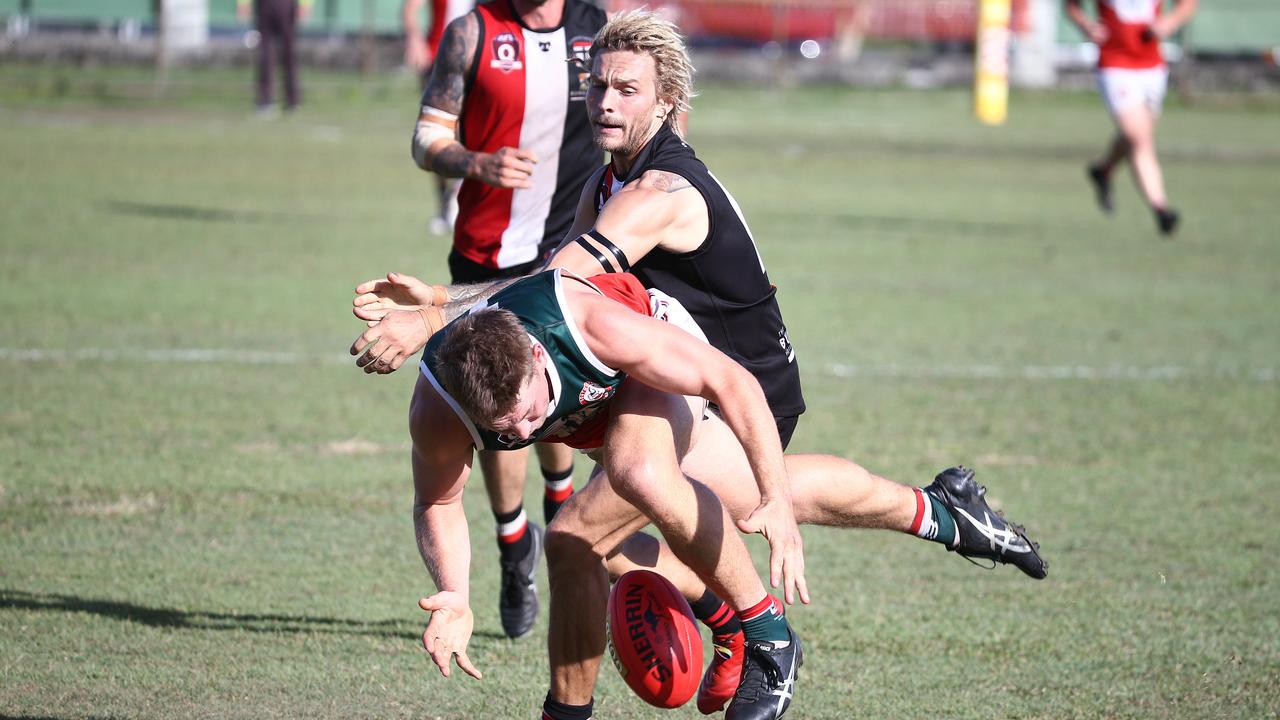 Saints' Chris Novy pushes Jack Marino off the ball in the AFL Cairns seniors match between the Cairns Saints and the South Cairns Cutters, held at Griffiths Park, Manunda. Picture: Brendan Radke