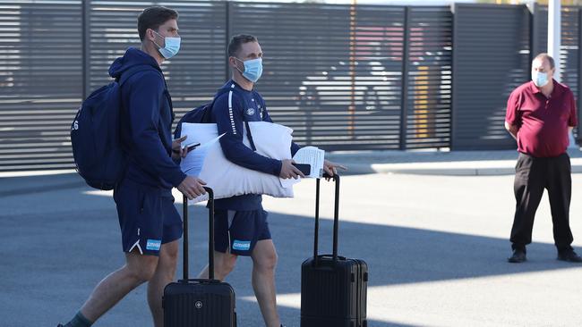 Geelong’s Tom Hawkins and Joel Selwood arriving at Perth Airport on July 11. Picture: Paul Kane/Getty Images.