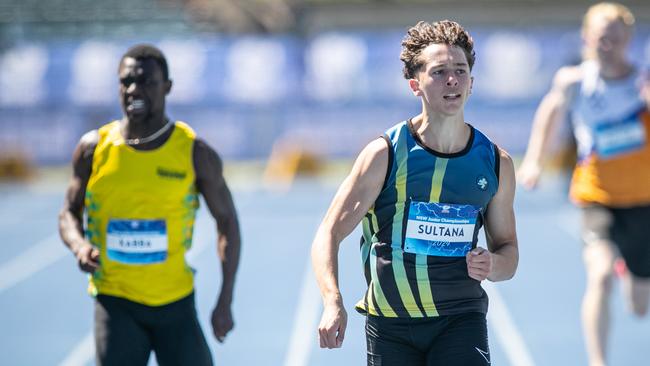 Sebastian Sultana from Campbelltown beating Rashid Kabba from Westfield into second place in the U20 200m. Picture: Julian Andrews