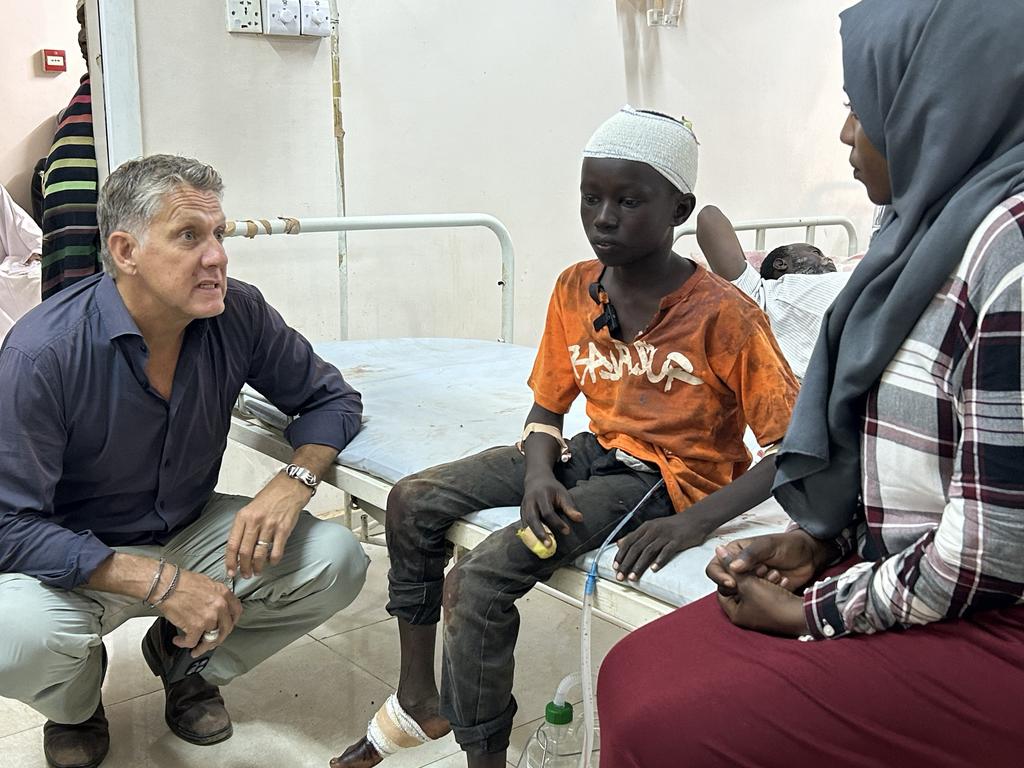 UNICEF spokesperson James Elder speaks to 13-year-old Abu at Al Nau hospital, Abu was injured by shrapnel while playing football at a UNICEF child-friendly space in Al Hattana in Khartoum. Picture: UNICEF