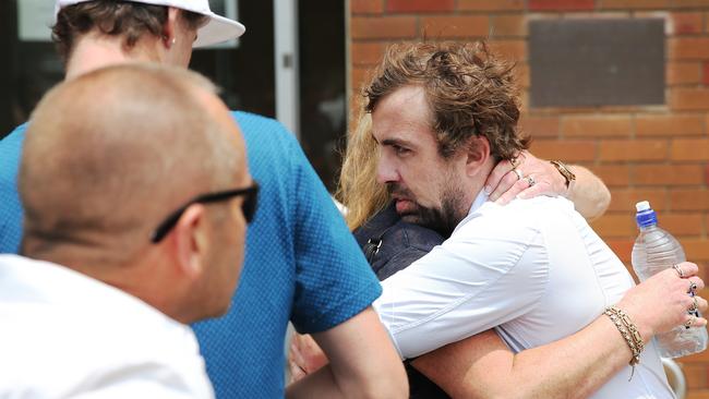 Danielle Easey's brother Brendon Easey, is consoled out the front of court. Picture: Peter Lorimer.