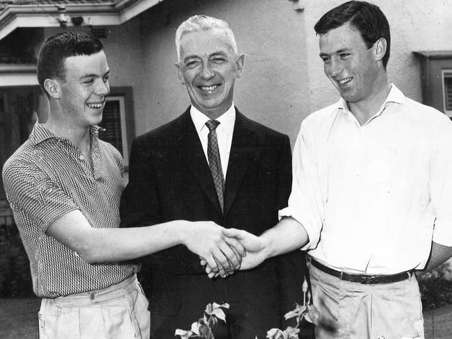 North Melbourne Football Club president Jack Adams being congratulated by his sons, Denis, 17, and John, 20 when he was appointed in 1961.