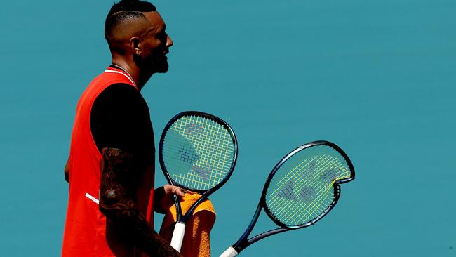 Nick Kyrgios of Australia carries his broken racquet. Picture: AFP