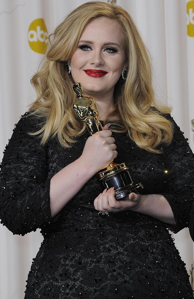 A first ... Adele with her Best Song Oscar for Skyfall last year. Picture: Gigi Iorio / Splash News