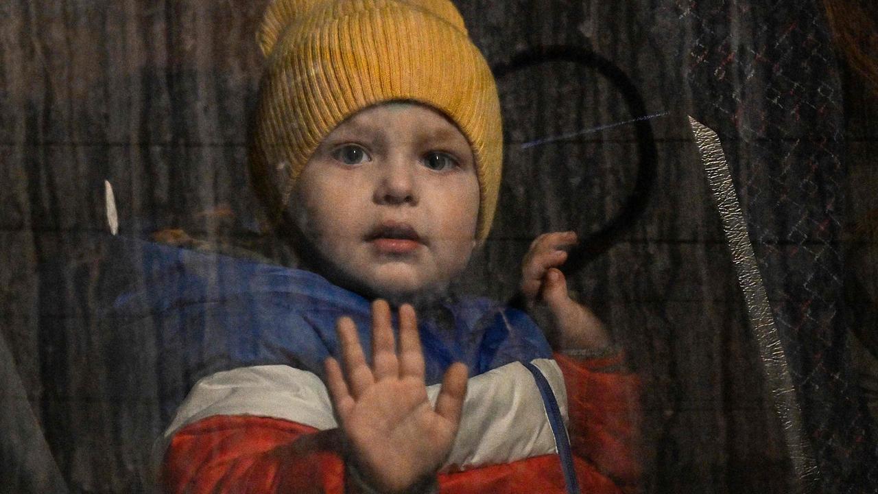 A child waiting to cross the border with Poland. Picture: Louisa Gouliamaki/AFP