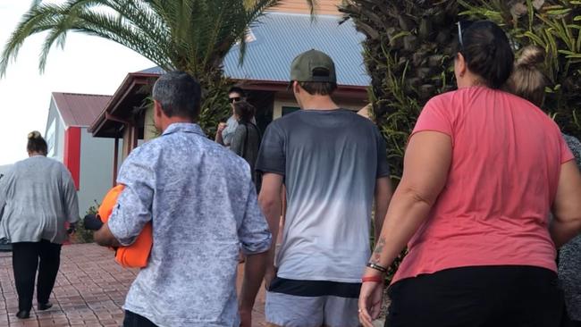 Mitchell Grimston (middle) was surrounded by family members when he was released on bail after facing charges of manslaughter at Lismore Local Court.