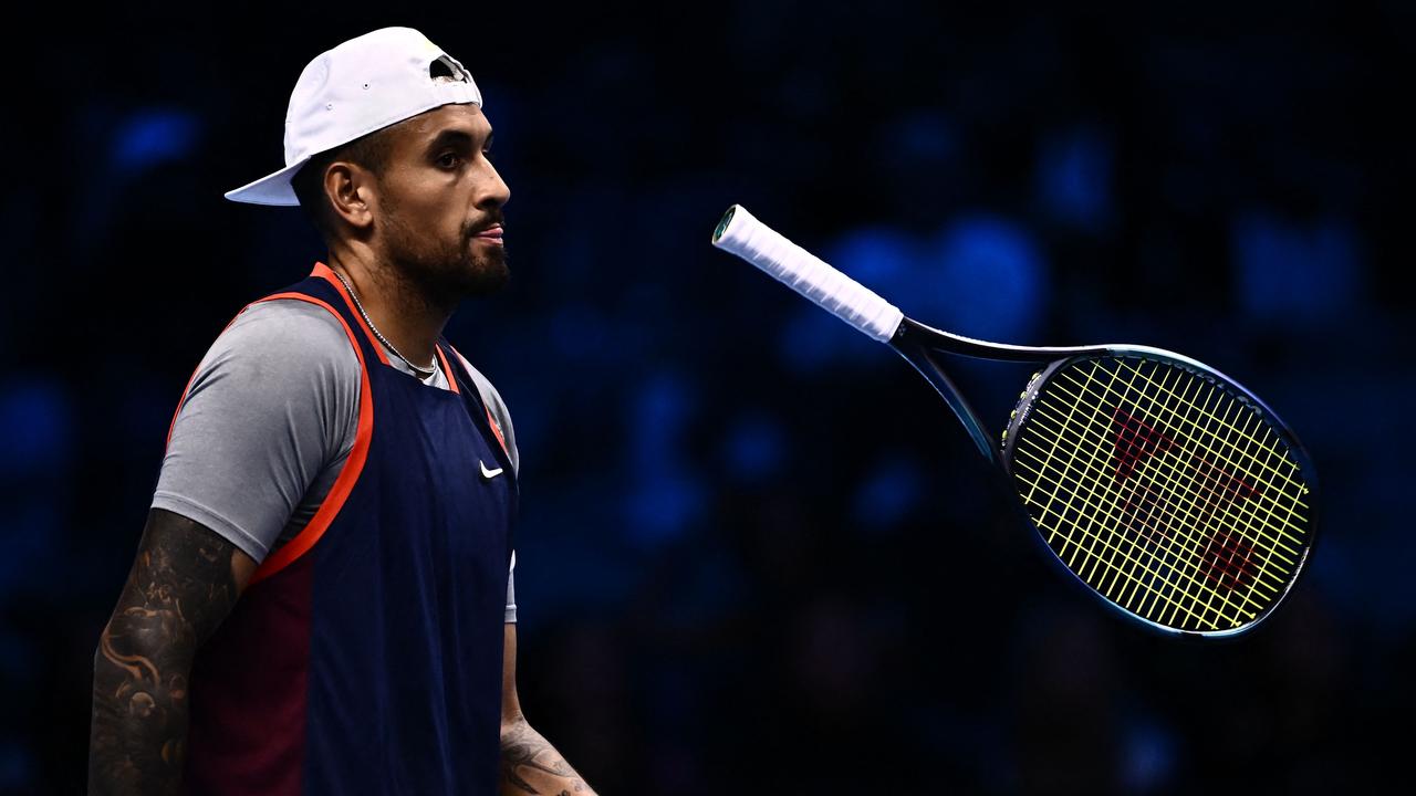 (FILES) This file photo taken on November 14, 2022 shows Australia's Nick Kyrgios reacting during his men's double round-robin match with Australia's Thanasi Kokkinakis against Britain's Neal Skupski and The Netherlands Wesley Koolhof at the ATP Finals tennis tournament in Turin. - Nick Kyrgios stunned his teammates by pulling out of the United Cup on December 28, 2022 on the eve of the tournament, soon after Rafael Nadal said the Australian had "all the weapons" to win a Grand Slam. (Photo by Marco BERTORELLO / AFP)