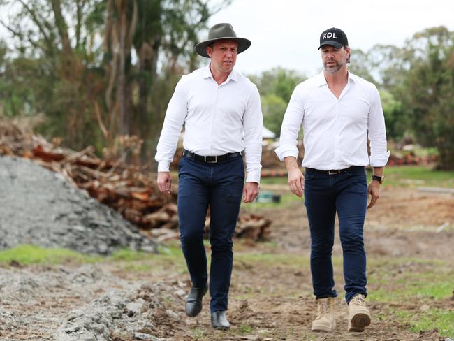 Deputy Premier Steven Miles and Kent Leicester, managing director of KDL Property Group at a housing development site at Joyner. Picture Lachie Millard