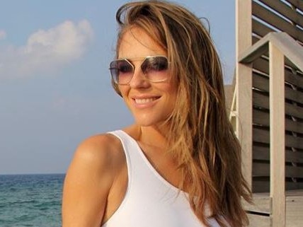 Liz Hurley looks incredible in a white swimsuit