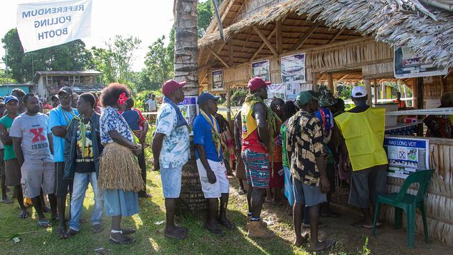 People queue outside a polling station at the Bougainville capital of Buka. Picture: AFP