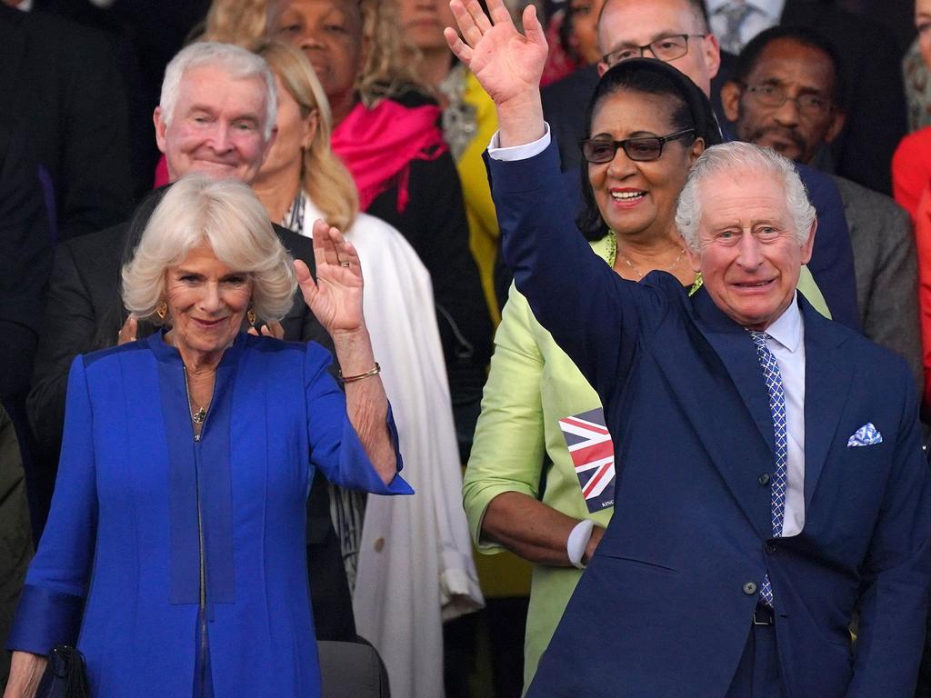 King Charles III and Queen Camilla wave to the jubilant crowds. Picture: AFP