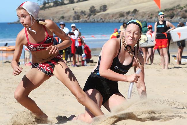 Competitors in the u/15 female beach flags event. Tasmanian Surf Lifesaving Championships at Clifton Beach. Picture: NIKKI DAVIS-JONES