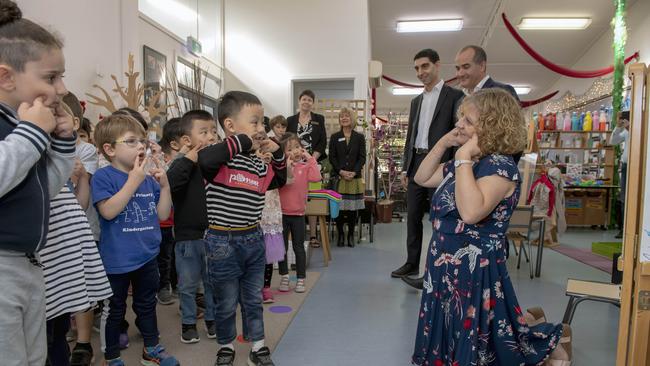 Paul Hamer MP, Deputy Premier and Minister for Education James Merlino, with Japanese teacher Rachael Martin and students at Box Hill North Kindergarten. Picture: Andy Brownbill