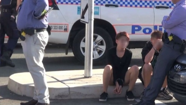 Photographs of teenagers in police custody after stolen vehicle crashed at Coomera. A 12-year-old homeless girl under the watch of Child Safety was with them. Photograph: My GC.