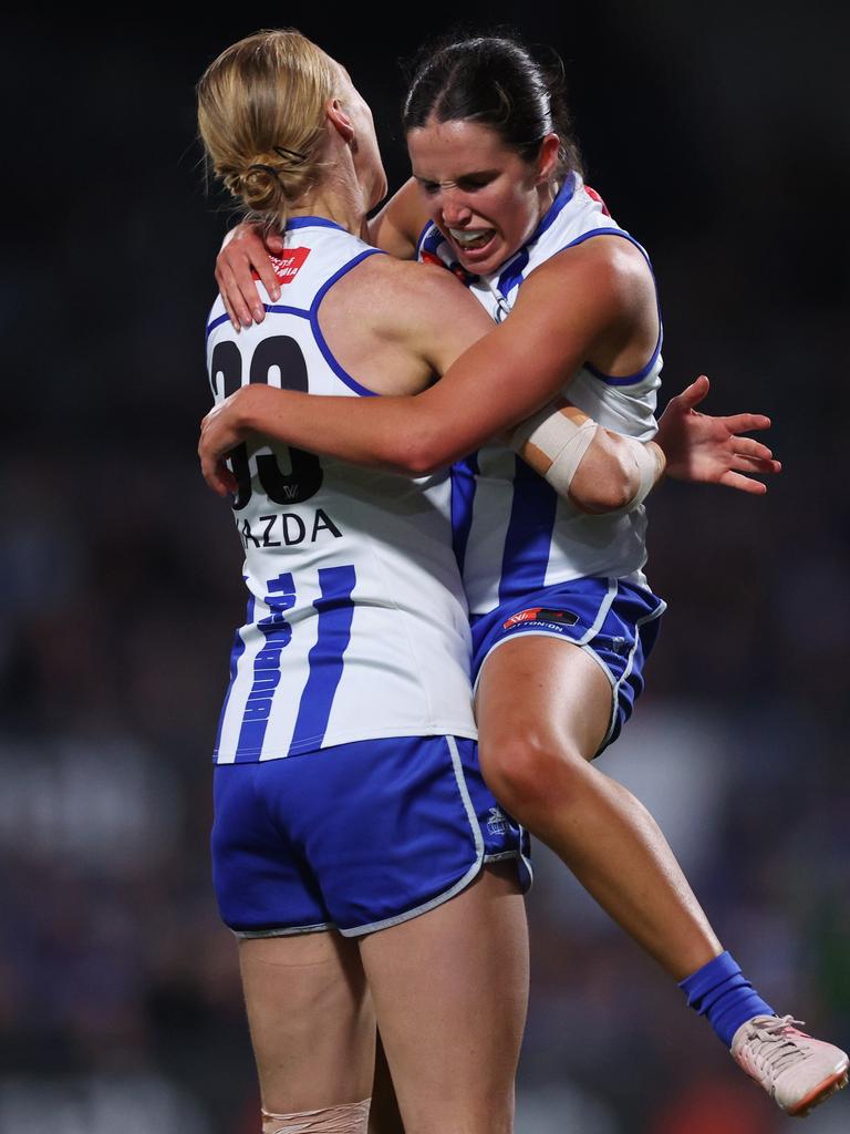 Bella Eddey and Kate Shierlaw celebrate a North Melbourne goal. Picture: Daniel Pockett/Getty Images