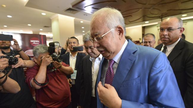 Former Malaysian PM Najib Razak walks out from a Kuala Lumpur courtroom on Tuesday. Picture: AP