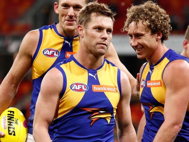 SYDNEY, AUSTRALIA - SEPTEMBER 16: Sam Mitchell (front), Drew Petrie (left) and Matt Priddis of the Eagles leave the field after their final match during the 2017 AFL First Semi Final match between the GWS Giants and the West Coast Eagles at Spotless Stadium on September 16, 2017 in Sydney, Australia. (Photo by Adam Trafford/AFL Media/Getty Images)