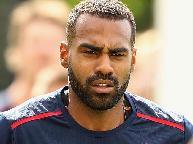 MELBOURNE, AUSTRALIA - NOVEMBER 21: Heritier Lumumba runs with team-mates during a Melbourne Demons media session at Gosch's Paddock on November 21, 2014 in Melbourne, Australia. (Photo by Robert Prezioso/Getty Images)