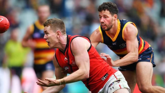 Essendon’s Jacob Townsend marks in front of Adelaide’s Luke Brown. Picture: Mark Brake/Getty Images