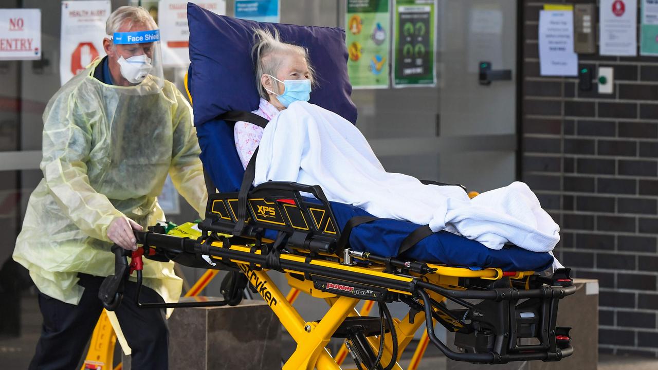 Medical workers evacuate a resident from the Epping Gardens aged care facility in the Melbourne suburb of Epping on July 30 amid a coronavirus outbreak. Picture William West/AFP