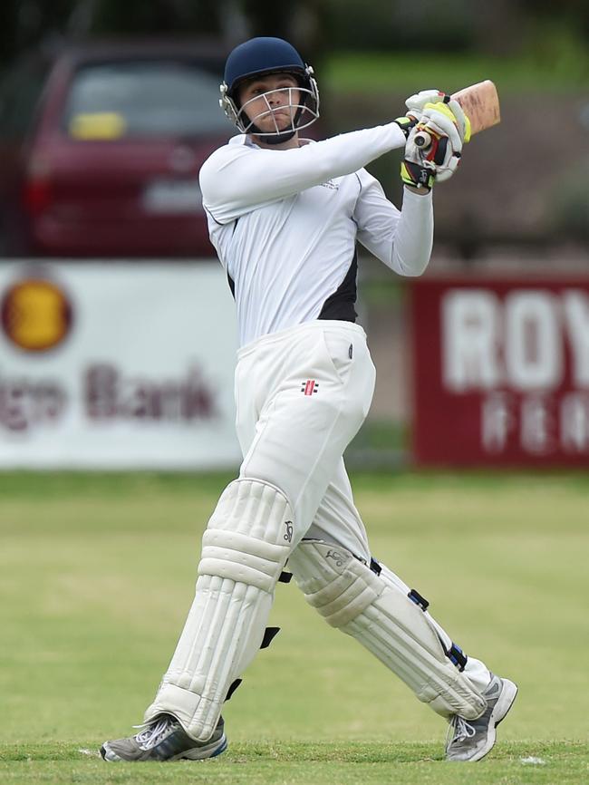 Nathan Walsh smashes a six in the FTGDCA grand final.