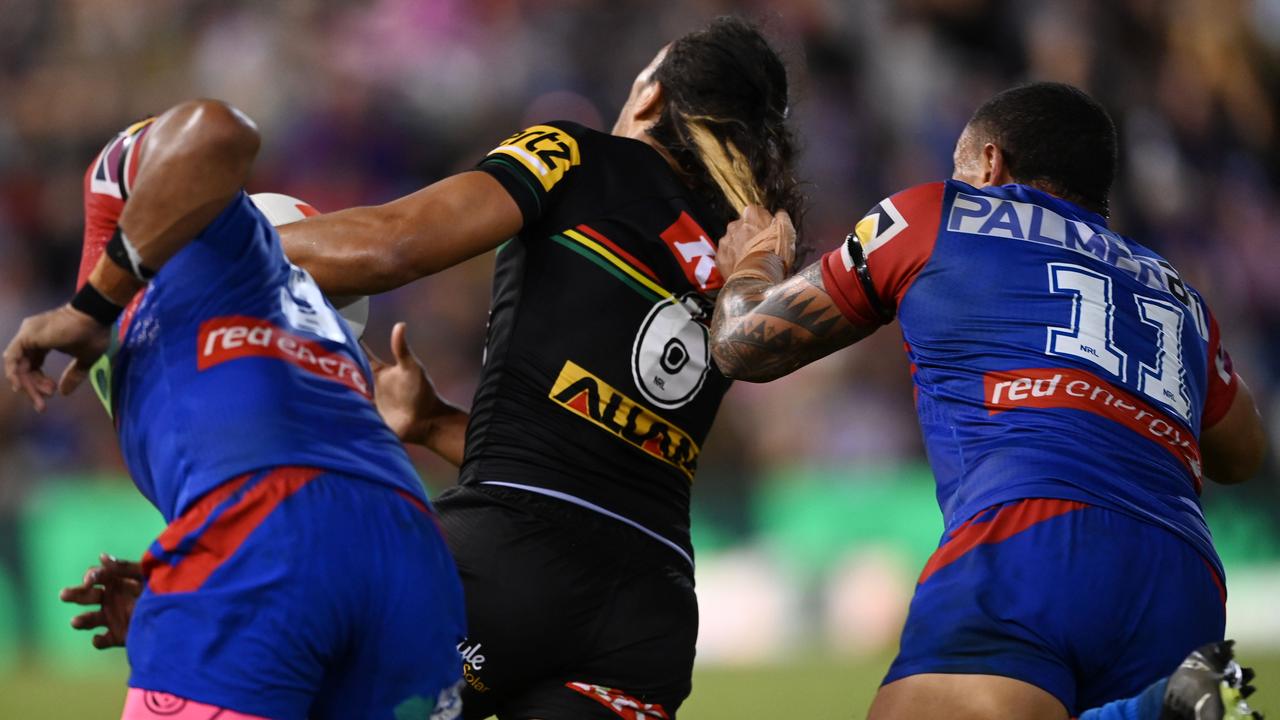 Tyson Frizell grabs Jarome Luai by the jumper — and his hair.