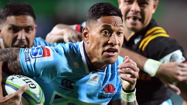 Israel Folau makes a break for the Waratahs against the Chiefs on Saturday night.