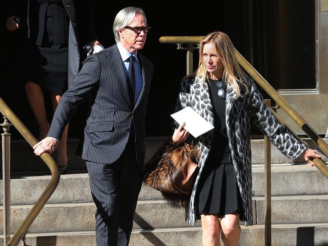 Fashion designer Tommy Hilfiger and Dee Ocleppo depart the funeral of fashion designer Oscar De La Renta.