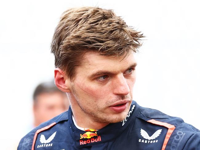 MONZA, ITALY - SEPTEMBER 01: Sixth place Max Verstappen of the Netherlands and Oracle Red Bull Racing and eighth place Sergio Perez of Mexico and Oracle Red Bull Racing, look on in parc ferme during the F1 Grand Prix of Italy at Autodromo Nazionale Monza on September 01, 2024 in Monza, Italy. (Photo by Mark Thompson/Getty Images)