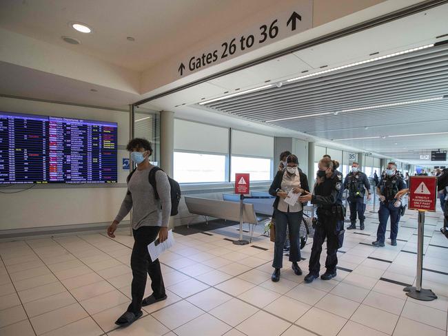 Passengers from a Perth flight head to hotel quarantine in Brisbane. Picture: NCA NewsWire /Jono Searle